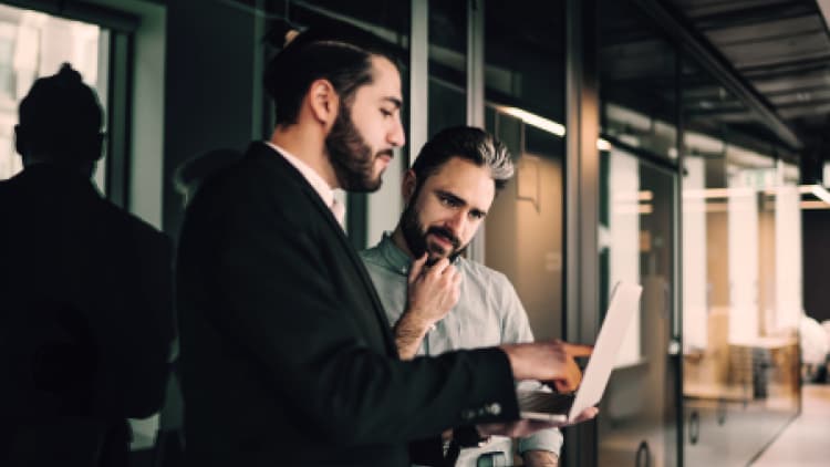 Two business professionals having a conversation.