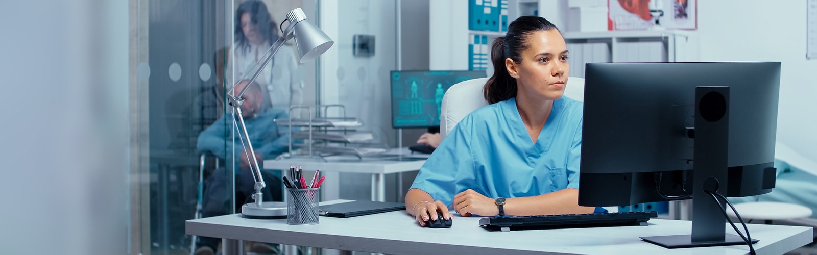 A medical worker using a desktop