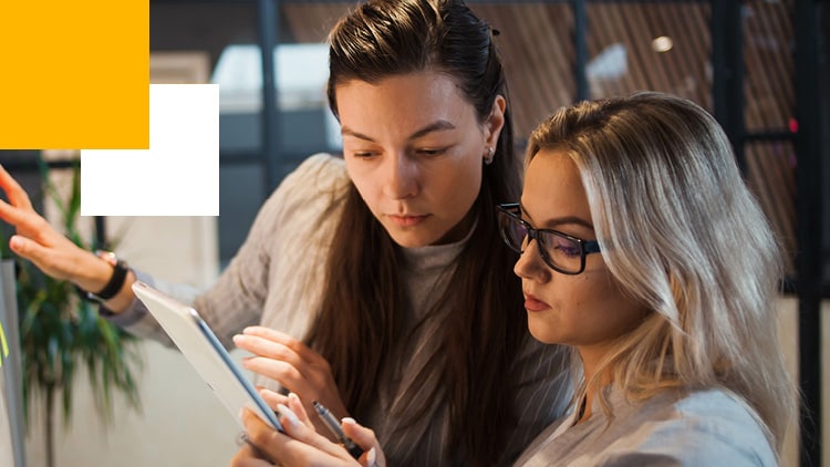 Two business professionals reviewing a report.