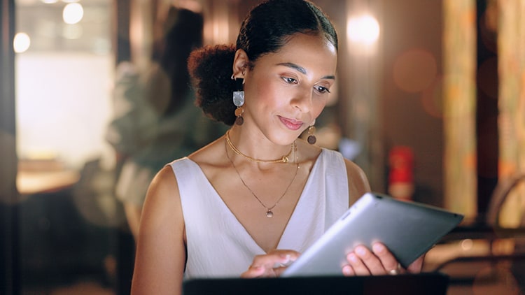 A woman looking at a tablet
