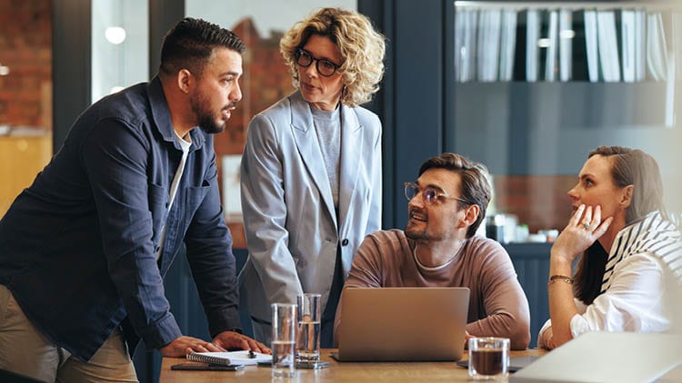 A team of business professionals discussing work.