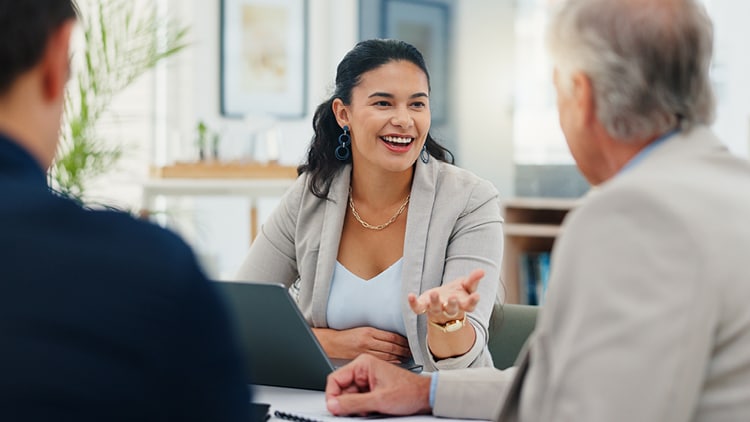 A Busines professional using a laptop.