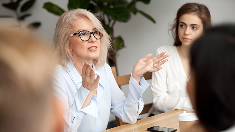 A group of colleagues having a discussion. 