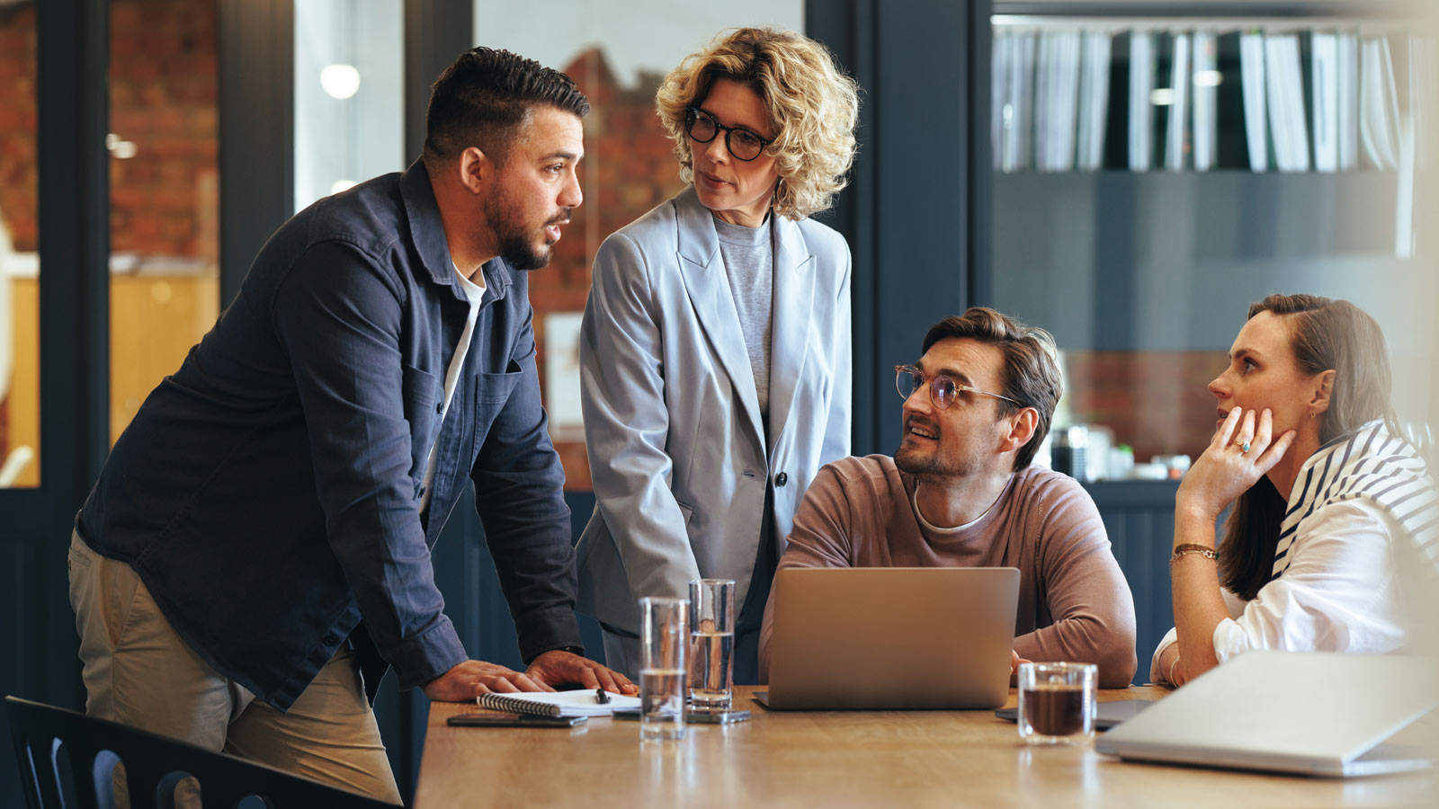 A team of business professionals having a discussion.