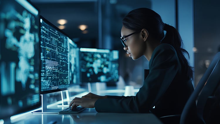 A person looking at a computer screen