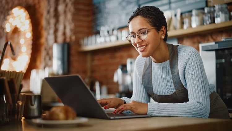woman looking at a laptop