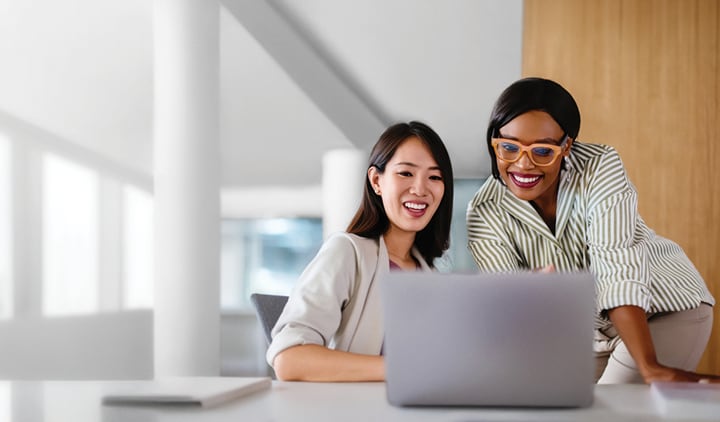 A woman looking at a computer